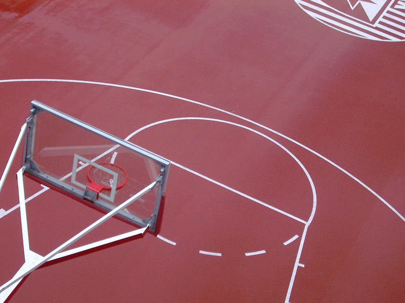an outdoor red couloured baskteball colour viewed from above