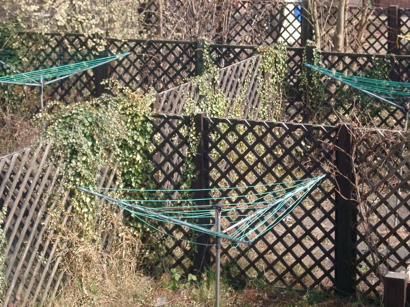 a paved outdoor area with a maze of fences, concept of confusion, lost direction, unplanned