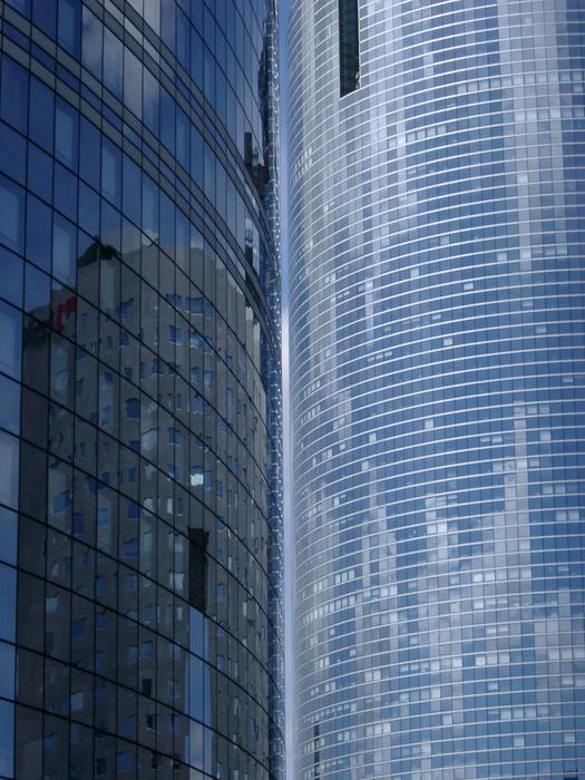 reflections in the windows of modern corporate architecture, paris, france