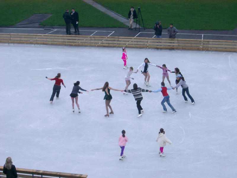 skating on an ice rink, concept: working together
