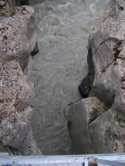 meltwater cutting a deep gorge through rock in the centre of iceland