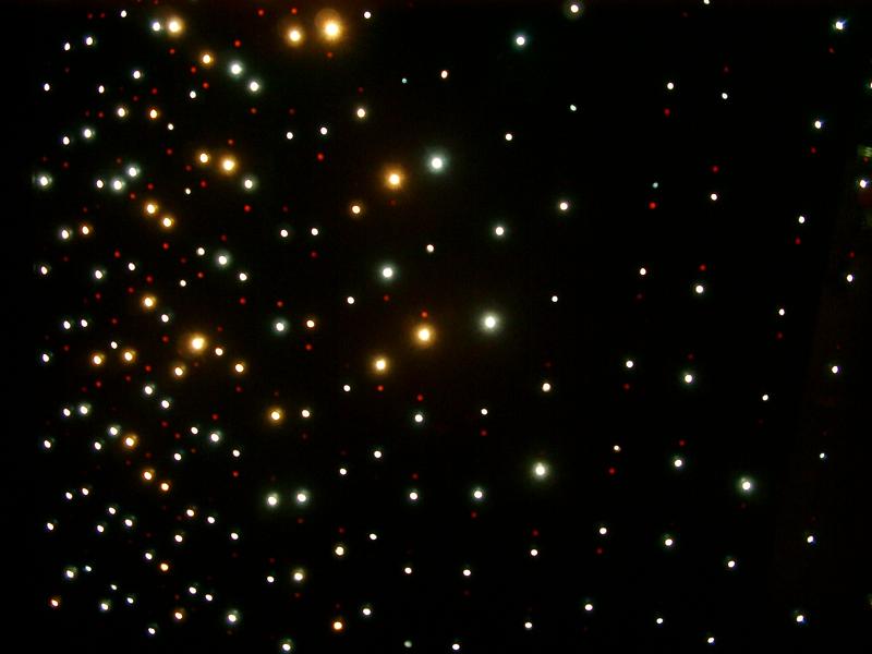 abstract pattern drops of light in green yellow and red