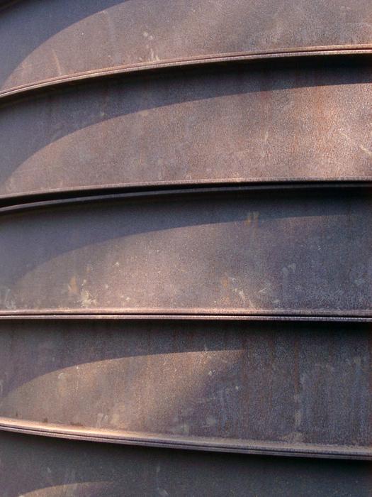 curved rusted metal slats