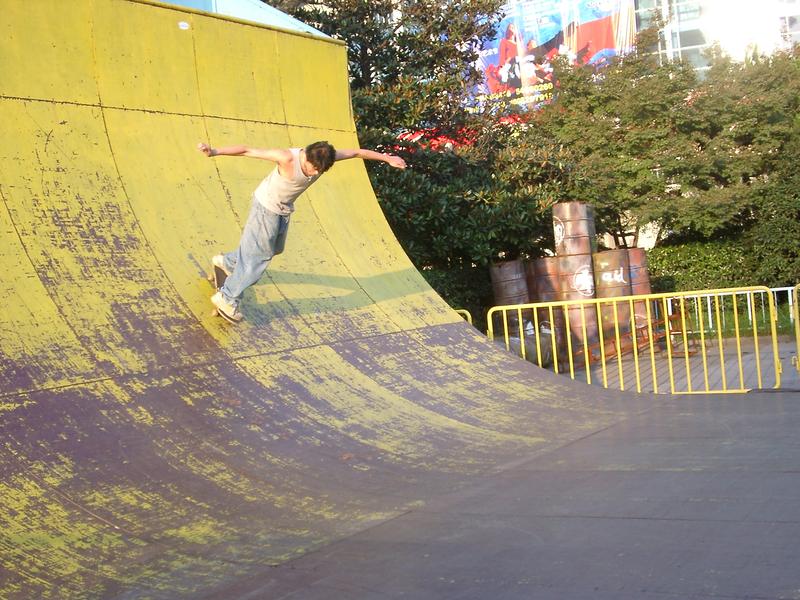 a skateboarder riding a halfpipe