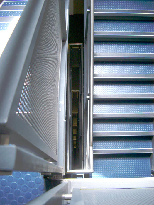 a flight of stairs with an anti-slip flooring