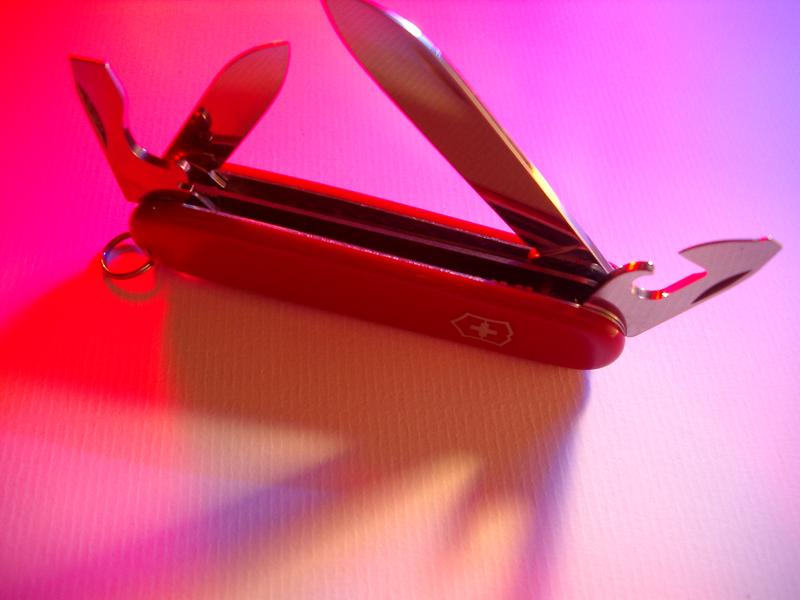 detail of the blades of a red swiss army knife