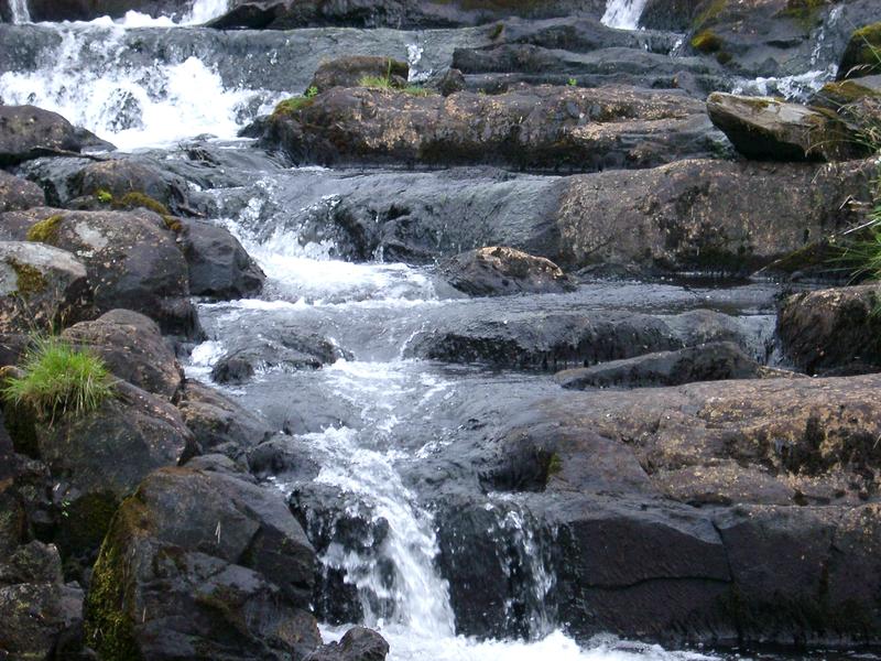 water bubbling over a small cascade in the north wales hills