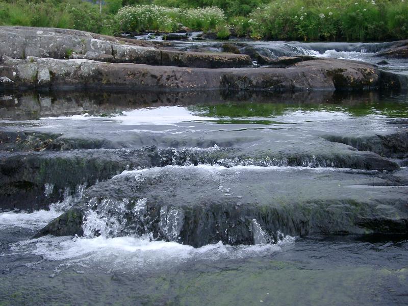 water bubbling over a small cascade in the north wales hills