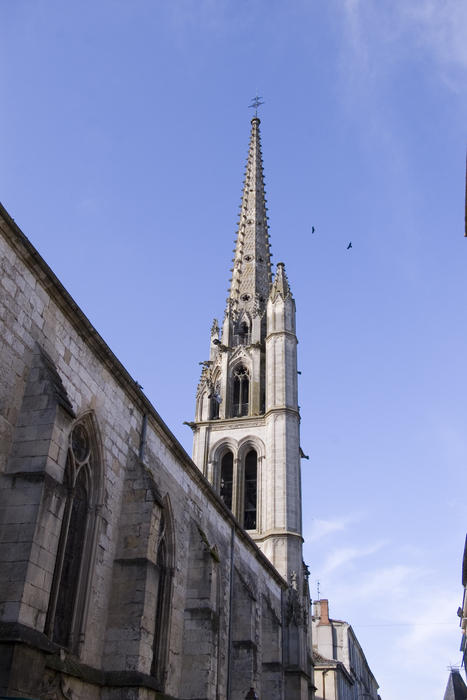 a french church tower with distinctive asymetric design