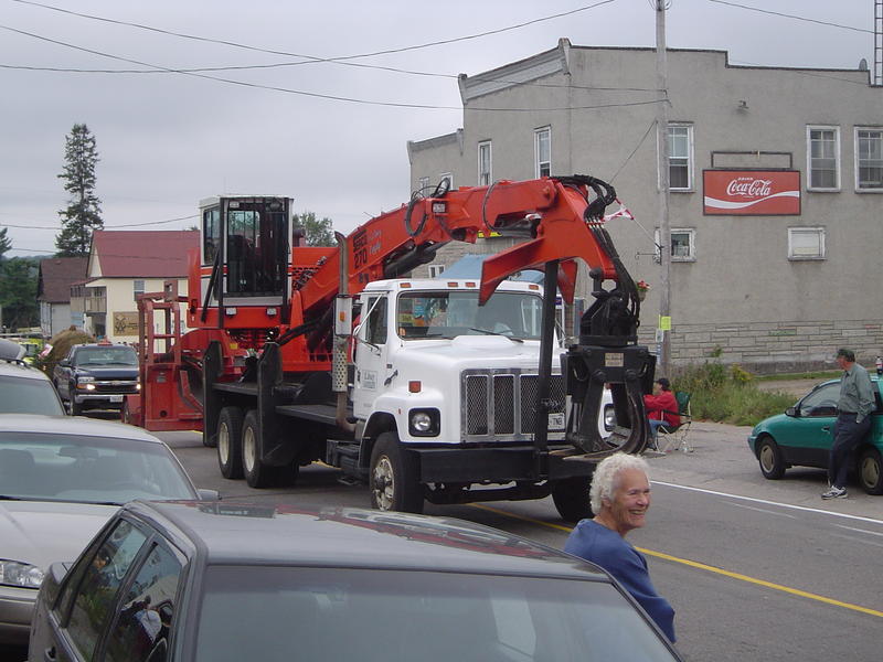 parade of logging trucks and forestry machinery, ontarion, canada