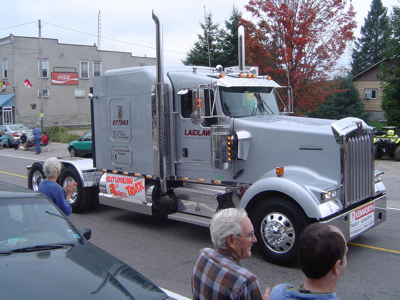 parade of logging trucks and forestry machinery, ontarion, canada