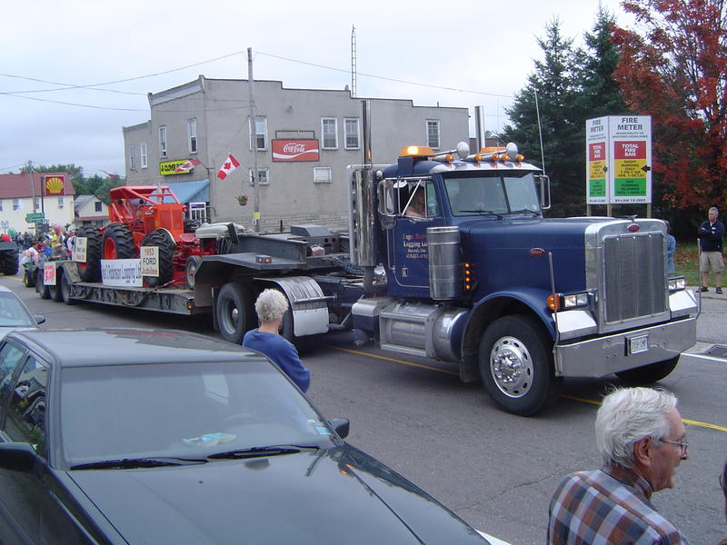 parade of logging trucks and forestry machinery, ontarion, canada