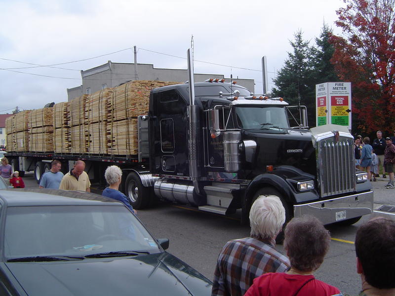 parade of logging trucks and forestry machinery, ontarion, canada