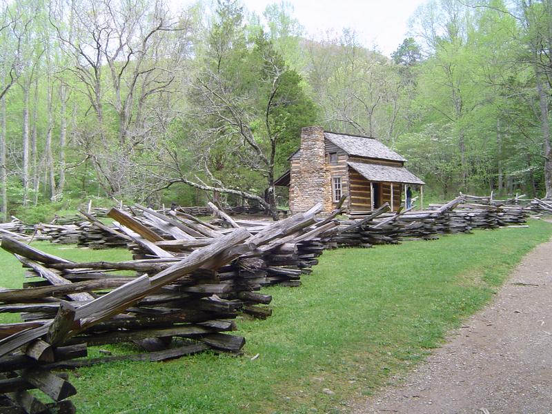 a rustic log cabin in the mountains