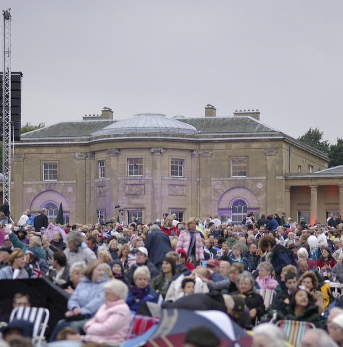 an outdoor concert and an english country house