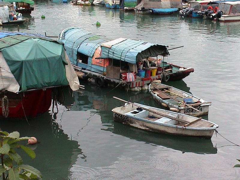 <p>Boat people in the harbour at Hong Kong, China</p>