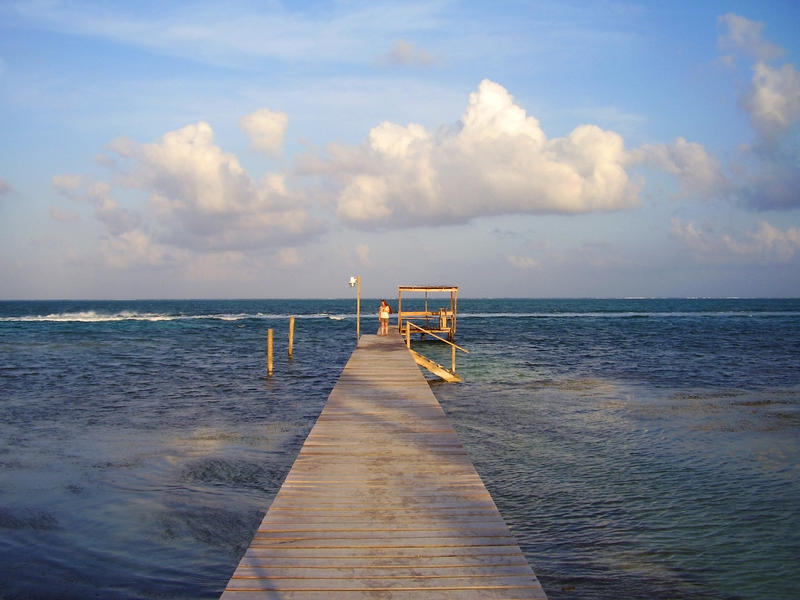 a long jetty strecthing out into the warters fo the Caribbean sea   