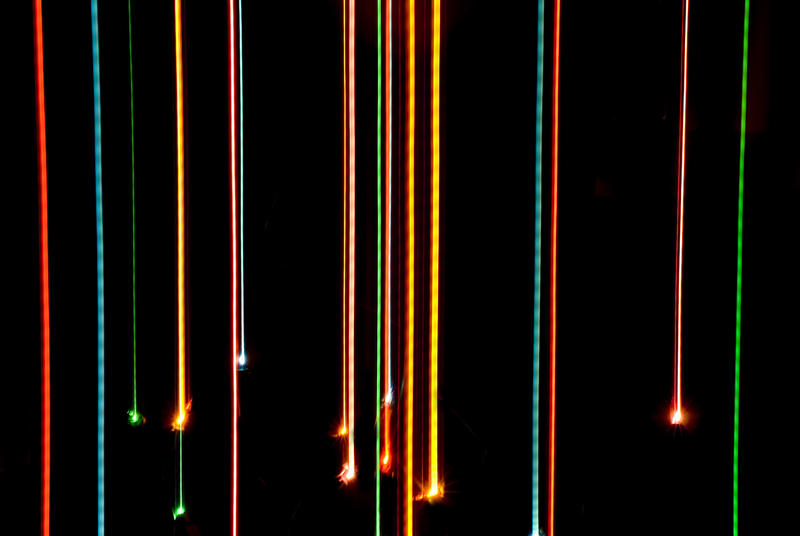 an abstract background image of christmas lights and light trails
