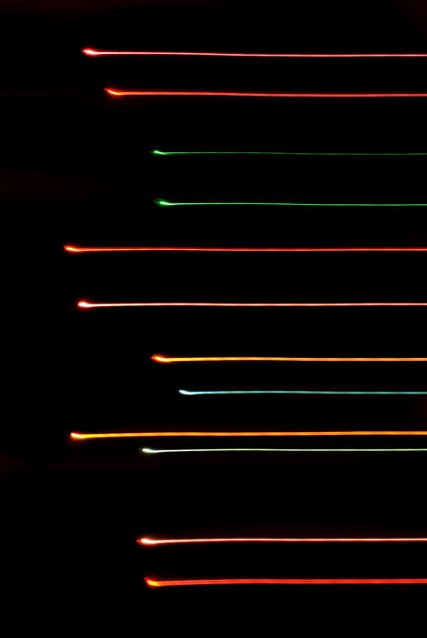 abstract image of lights on a black background with a linear motion blur