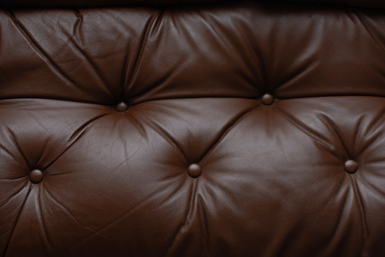 low pleated leather sofa