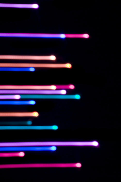 streaking lines of parallel purple and pink coloured light