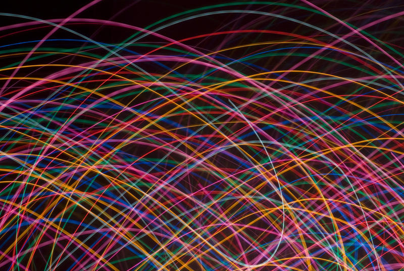 multicoloured crisscrossing curved lines of coloured light on a black background. I used this composition for my twitter background http://twitter.com/Creativity103