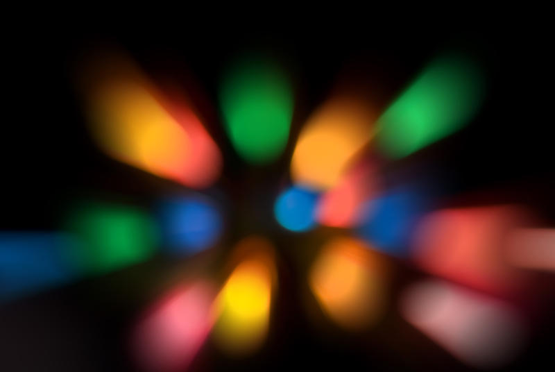 a 'slap zoom' effect abstract background composed of out of focus coloured lights