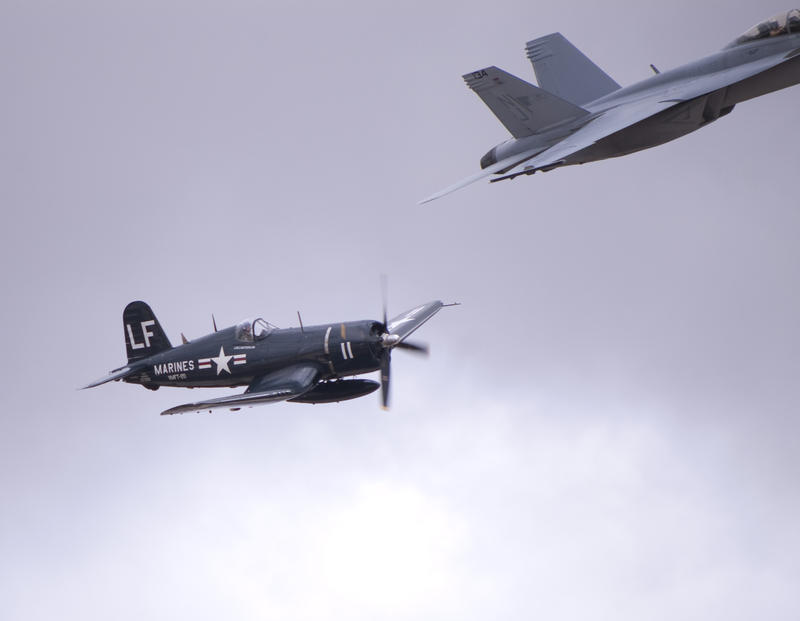 a navy F4U Corsair and the tail end of an FA18 Hornet