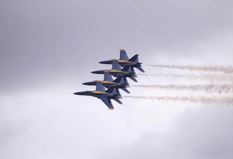 the navy blue angels display team perform an Echelon Parade