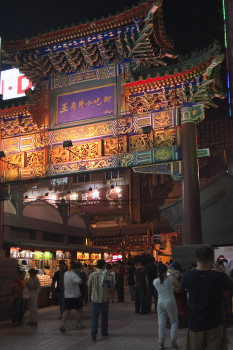a Paifang in a busy marketplace, traditional chinese gate