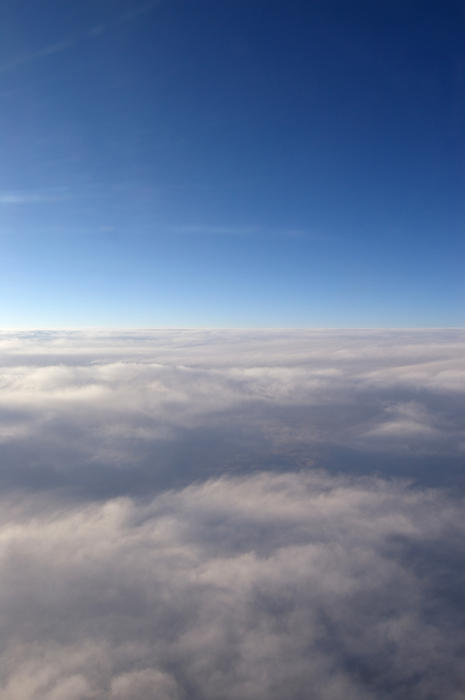 the view from a plane window at cruising altitude