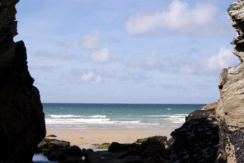 looking out to sea from a secluded cove on a beach near newquay