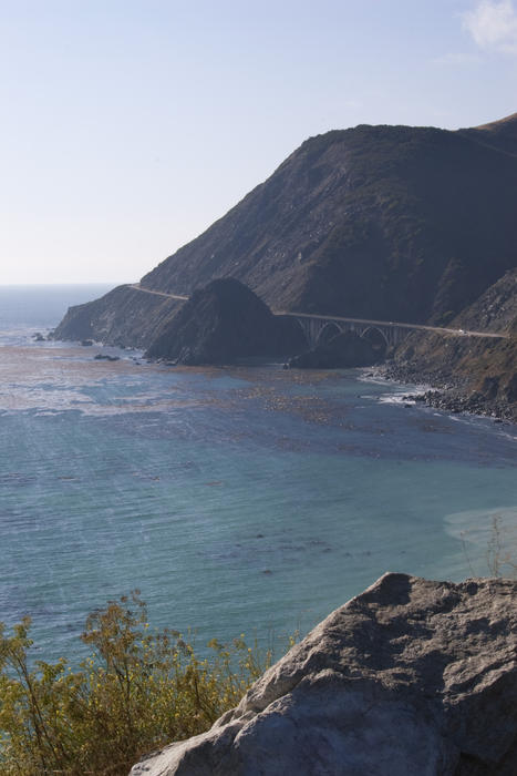 concrete arch bridges tower over big creek on the big sur coast, california