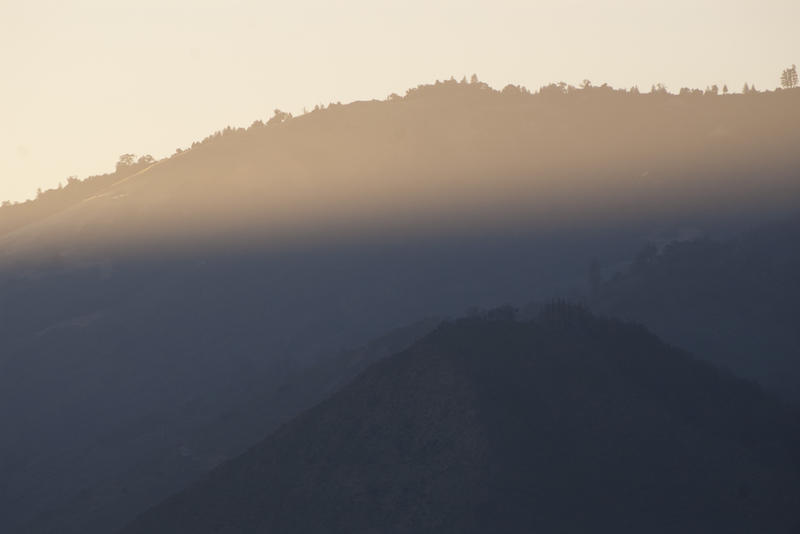 a beam of sunlight across the bigsur cliff landscape