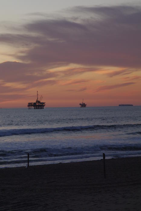 oil rings of the california coast at sunset