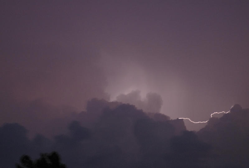 lighting flash between clouds in a thunderstorm - blurred image