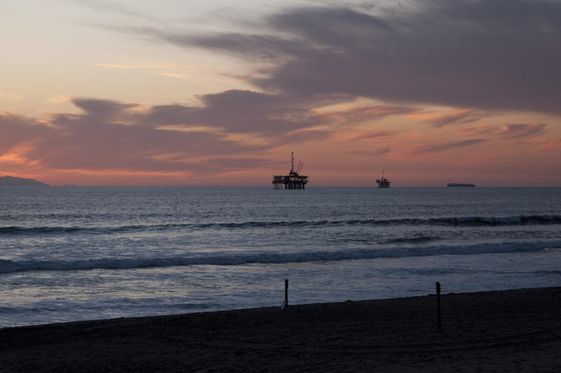 oil rings off the california coast at sunset