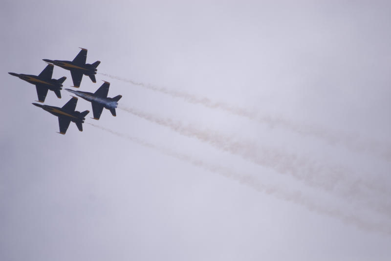 4 hornet jet aircraft flying in a diamond fromation