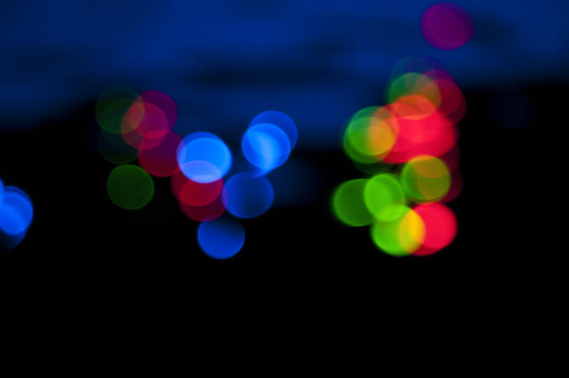 a backround of colorful bokeh circles from an out of focus camera lens