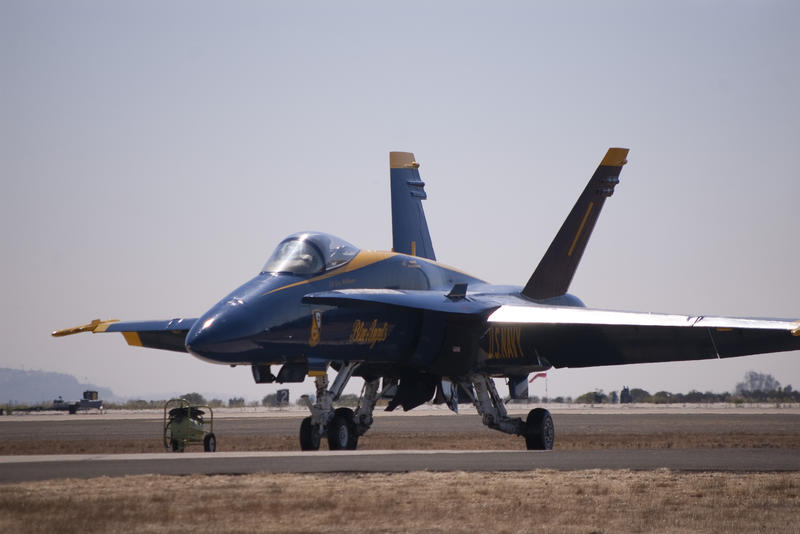 a blue angels hornet sat on the air field