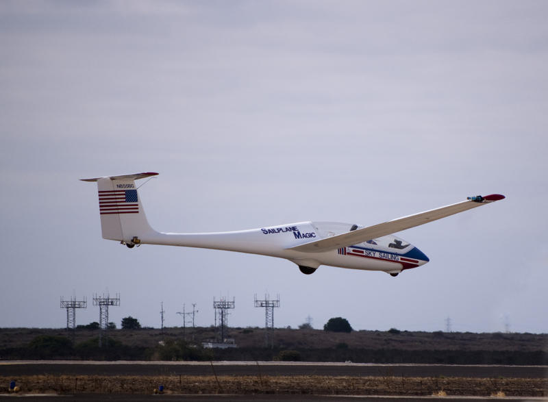 a glider plane making a landing