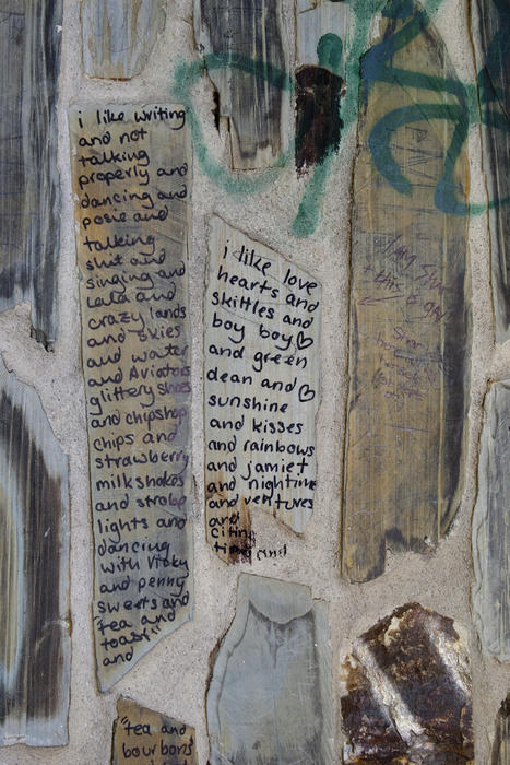 marker pen graffiti poetry on a tiled wall, poems of I like