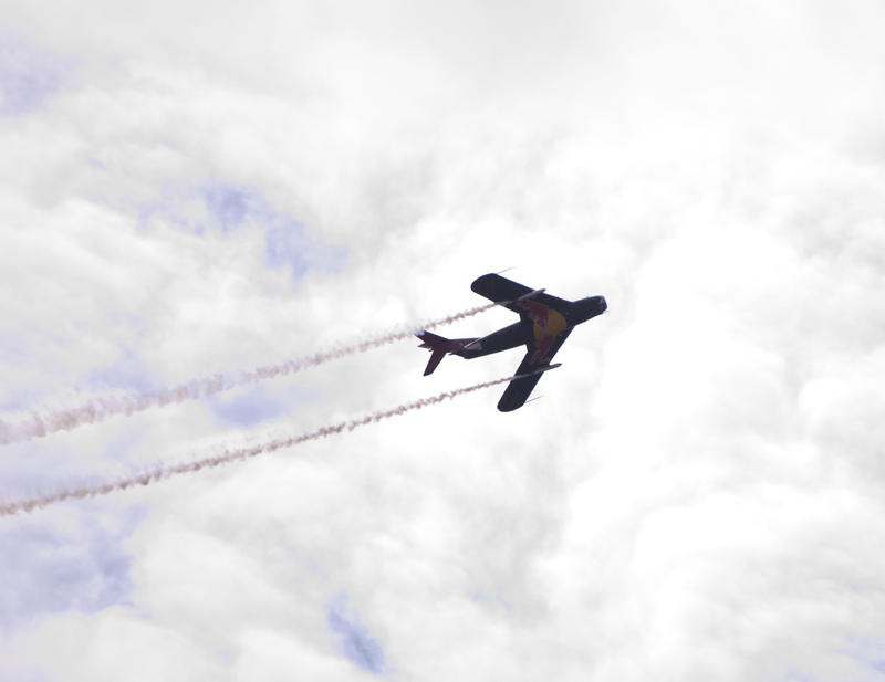 a restored mig 17 fighter plane in flight