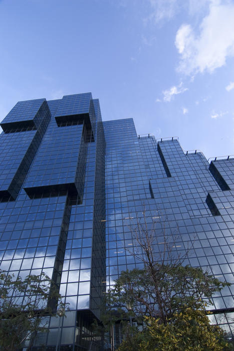 mirrored glass windows of a modern office building