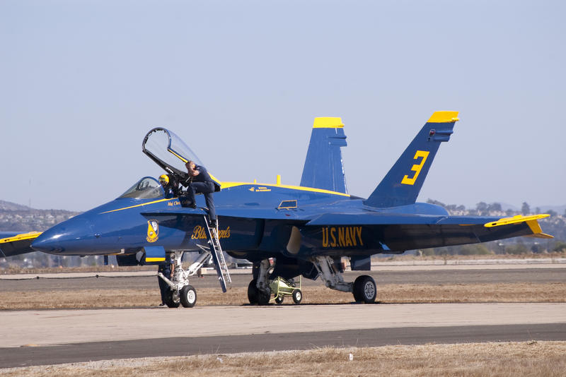 a navy hornet on the tarmac ready for an air display