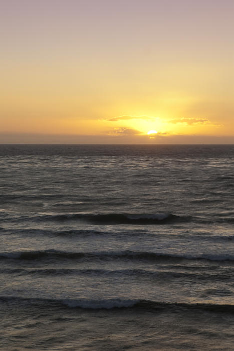 sun setting over the pacific ocean