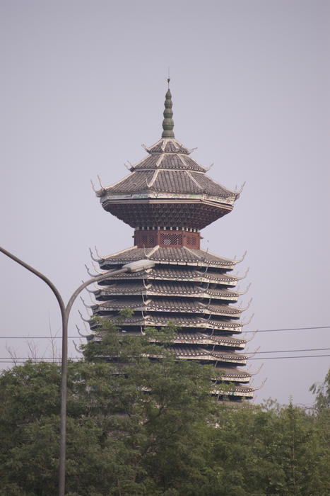 a tall pagoda in beijing with many tiers and ornate carvings