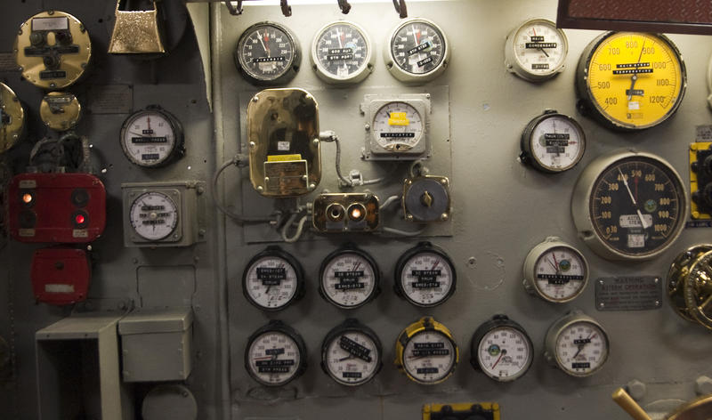rows of old fashioned mechanical gauges and dials
