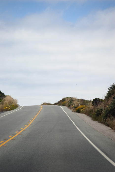 a road crest at the top of as hill