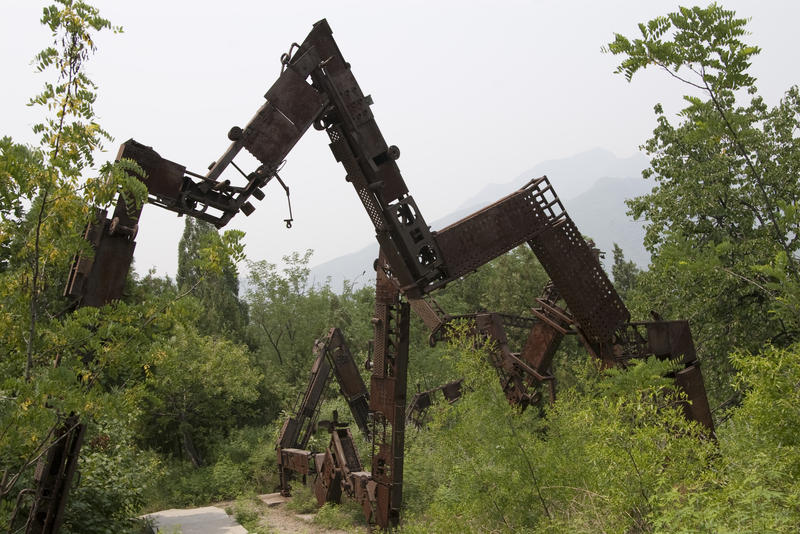 a rusted metal modern art sculpture